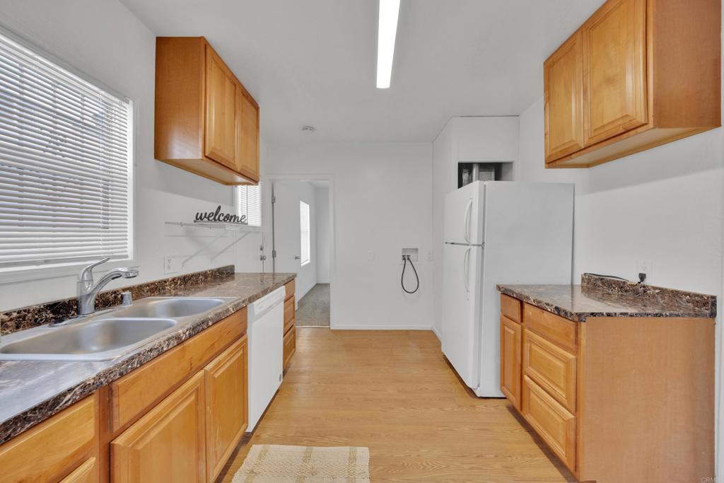 9015-9017 Campo Road Spring Valley, CA 91977 - Photo 35 of 60 a kitchen with stainless steel appliances granite countertop a sink a stove and a refrigerator