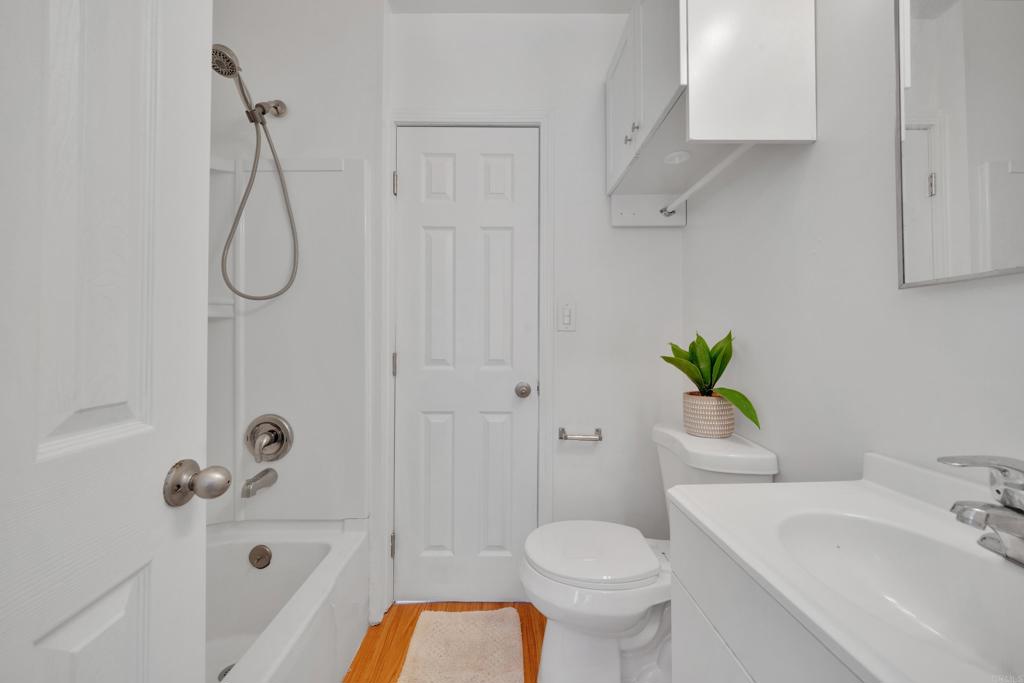 9015-9017 Campo Road Spring Valley, CA 91977 - Photo 42 of 60 a bathroom with a sink a toilet and shower