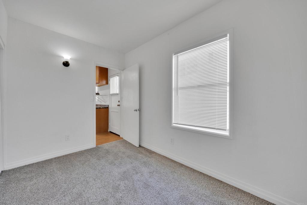 9015-9017 Campo Road Spring Valley, CA 91977 - Photo 44 of 60 a view of an empty room with a window