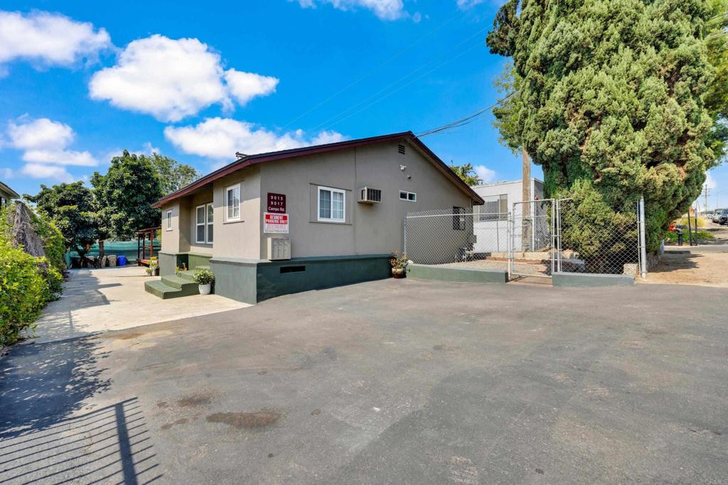 9015-9017 Campo Road Spring Valley, CA 91977 - Photo 60 of 60 a view of a house with a backyard