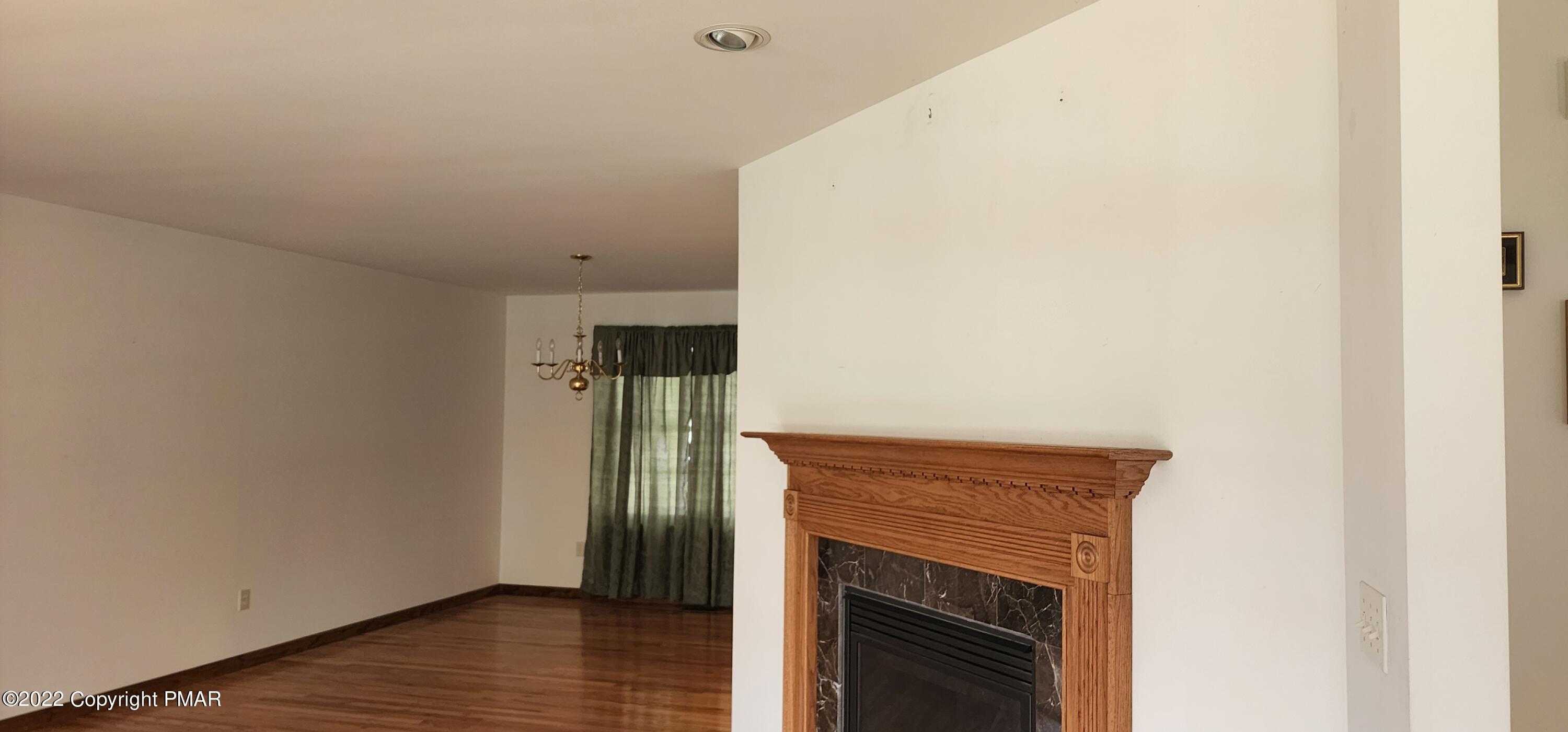 203 Sutton Place Pocono Summit, PA 18346 - Photo 11 of 22 a view of hallway with wooden floor