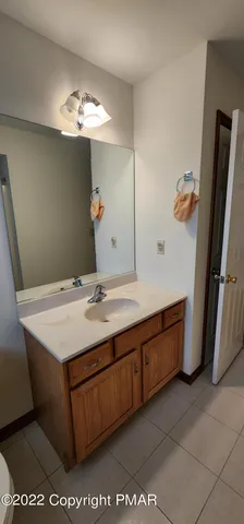 a bathroom with a sink a vanity and a mirror