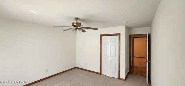 a view of a hallway with a closet