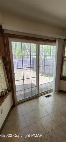 a view of a room with large windows