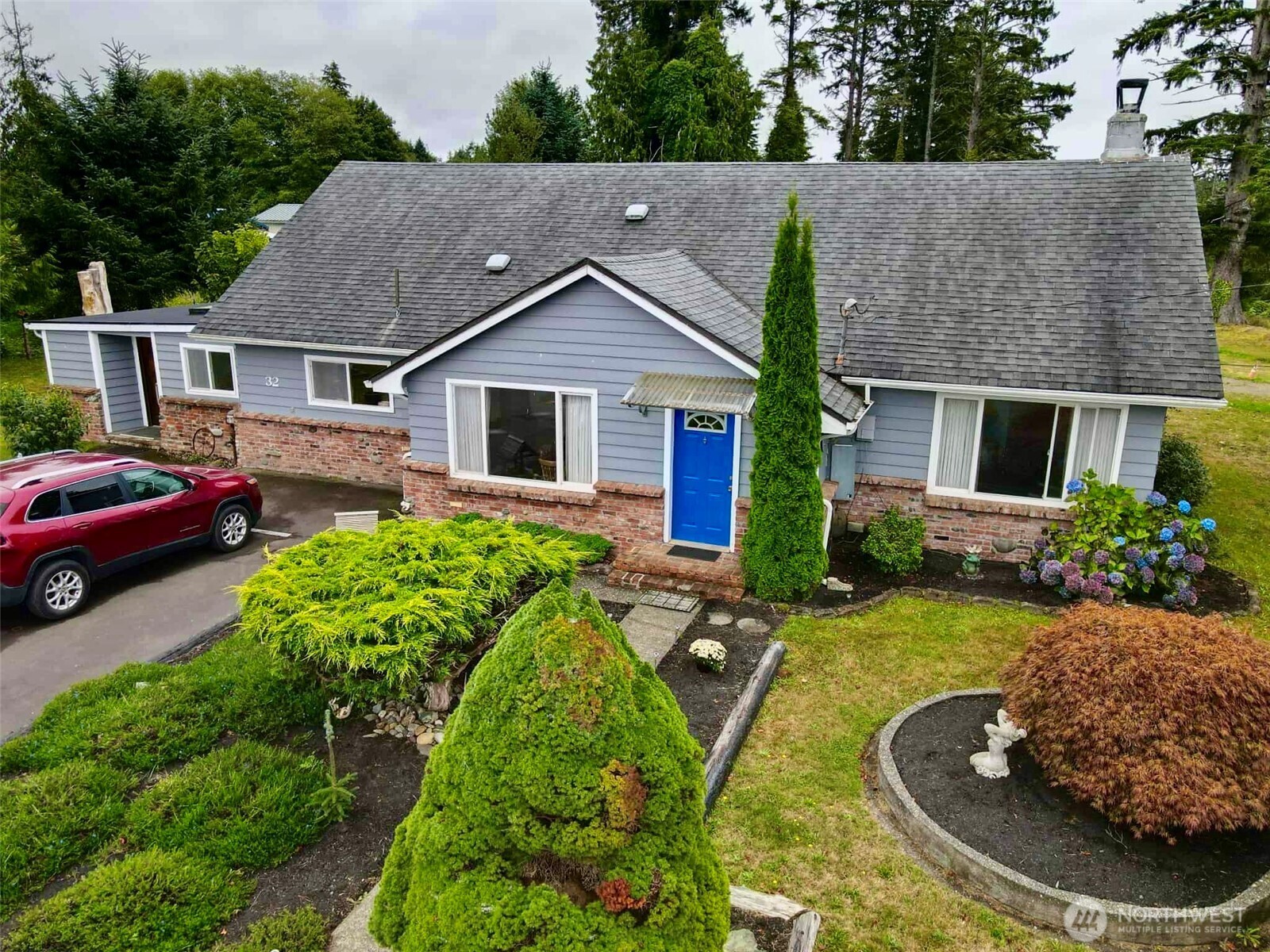 a aerial view of a house with swimming pool and porch