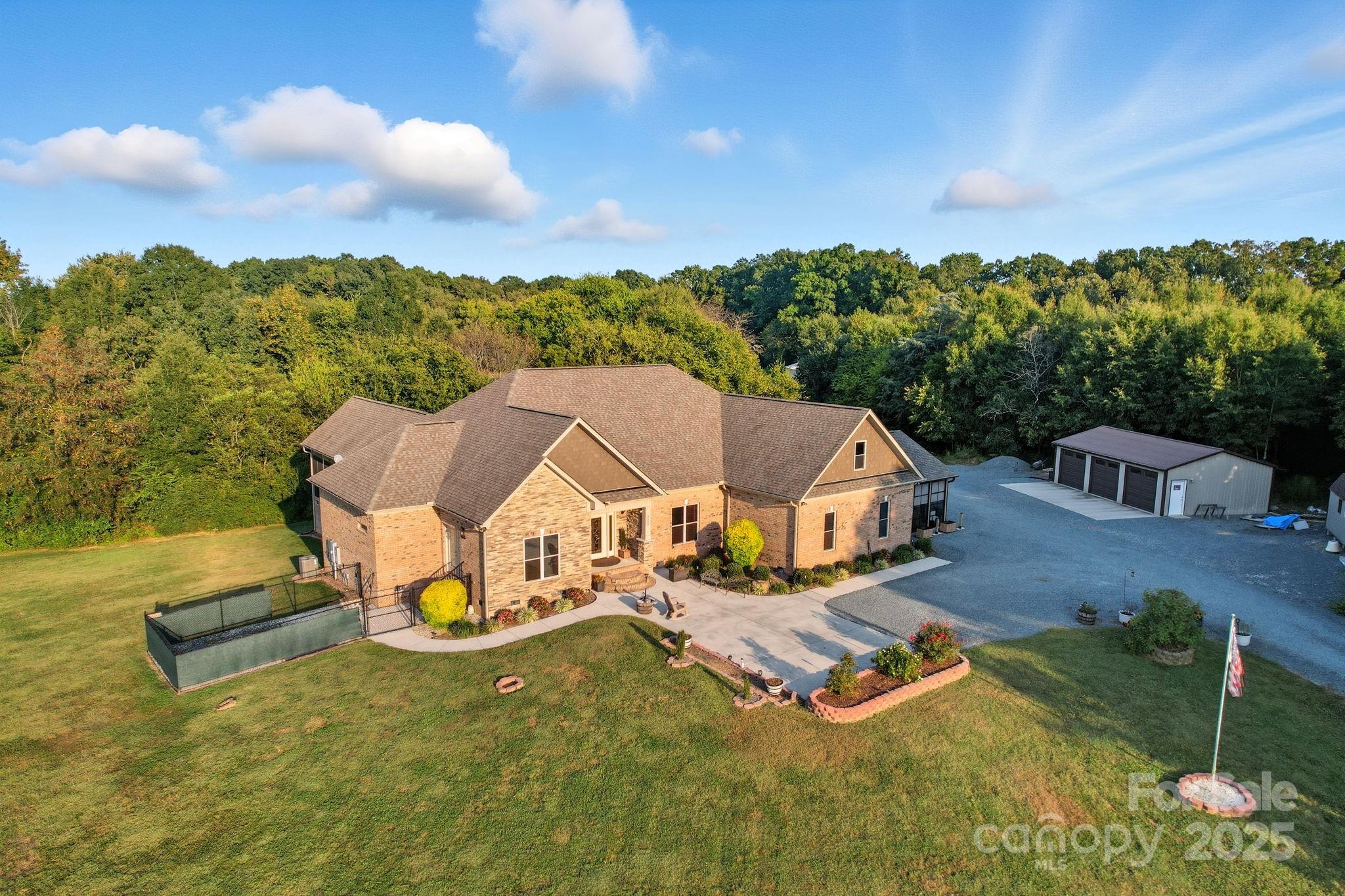 an aerial view of a house having swimming pool garden and patio