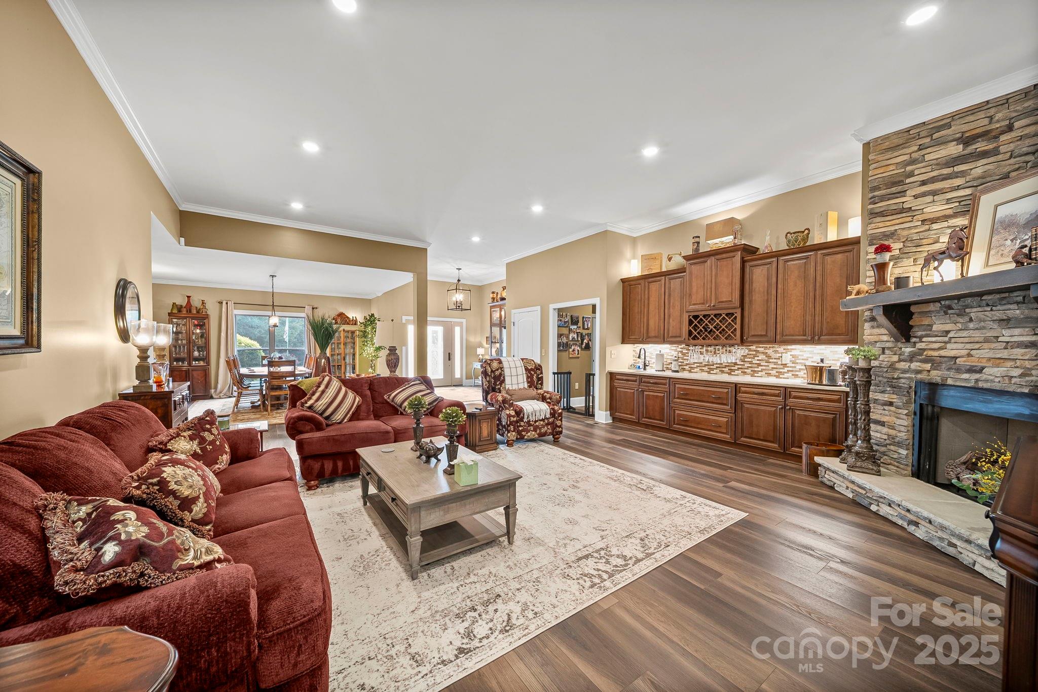 5702 Army Road Marshville, NC 28103 - Photo 11 of 48 a living room with furniture wooden floor and a fireplace
