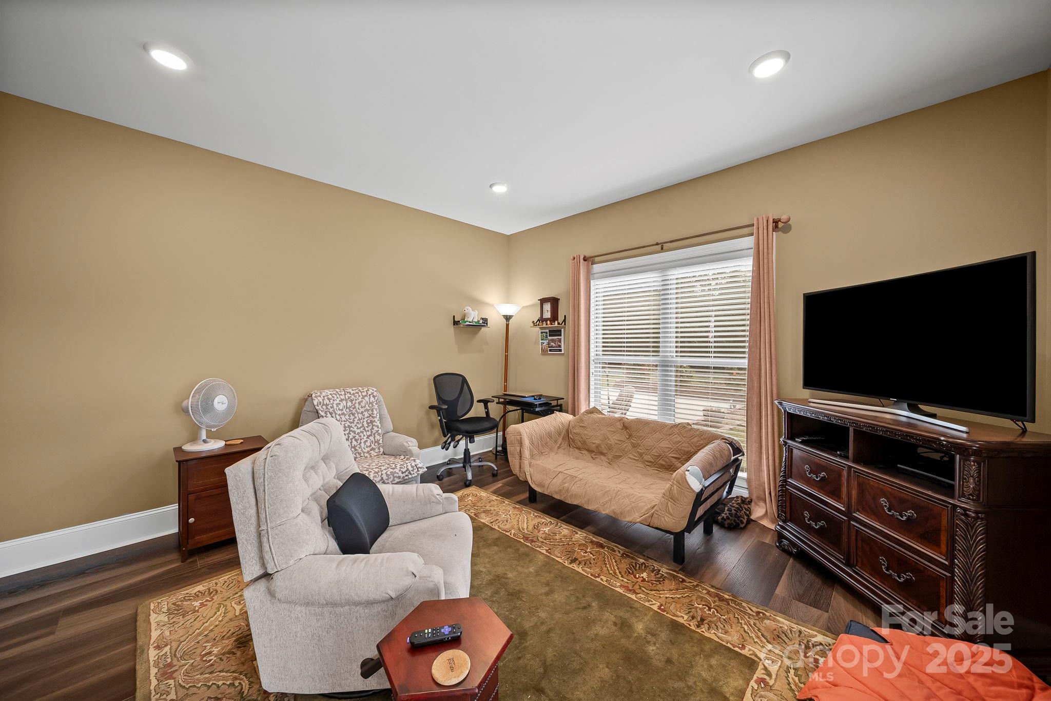 5702 Army Road Marshville, NC 28103 - Photo 12 of 48 a living room with furniture and a flat screen tv