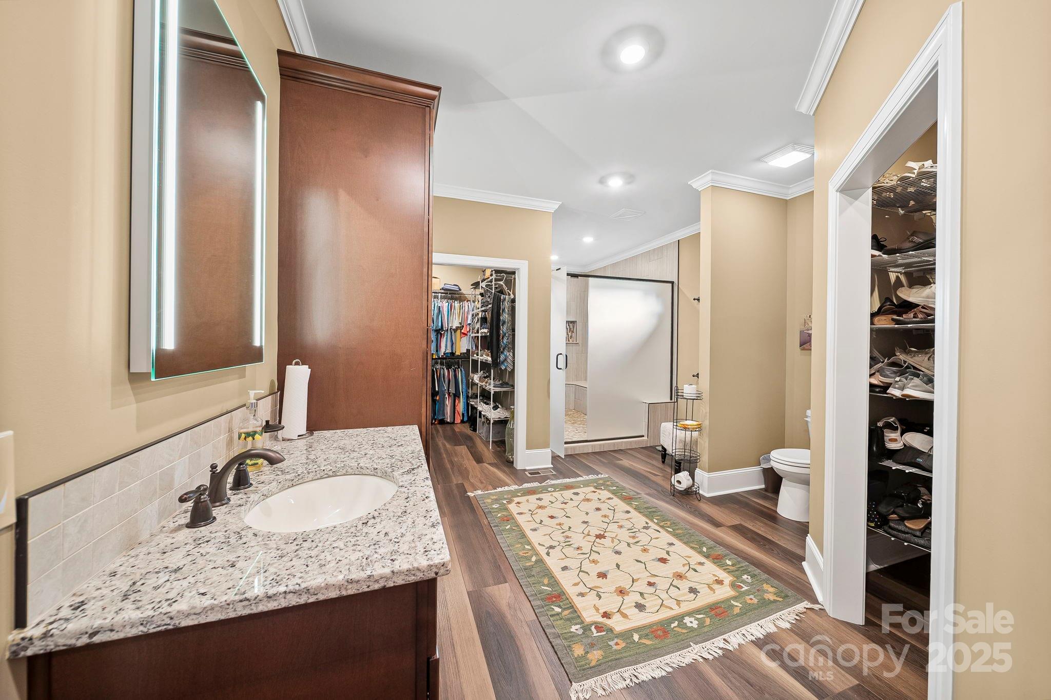 5702 Army Road Marshville, NC 28103 - Photo 14 of 48 a bathroom with a granite countertop sink and a mirror