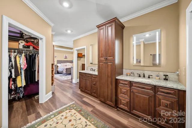 a bathroom with a double vanity sink and a mirror