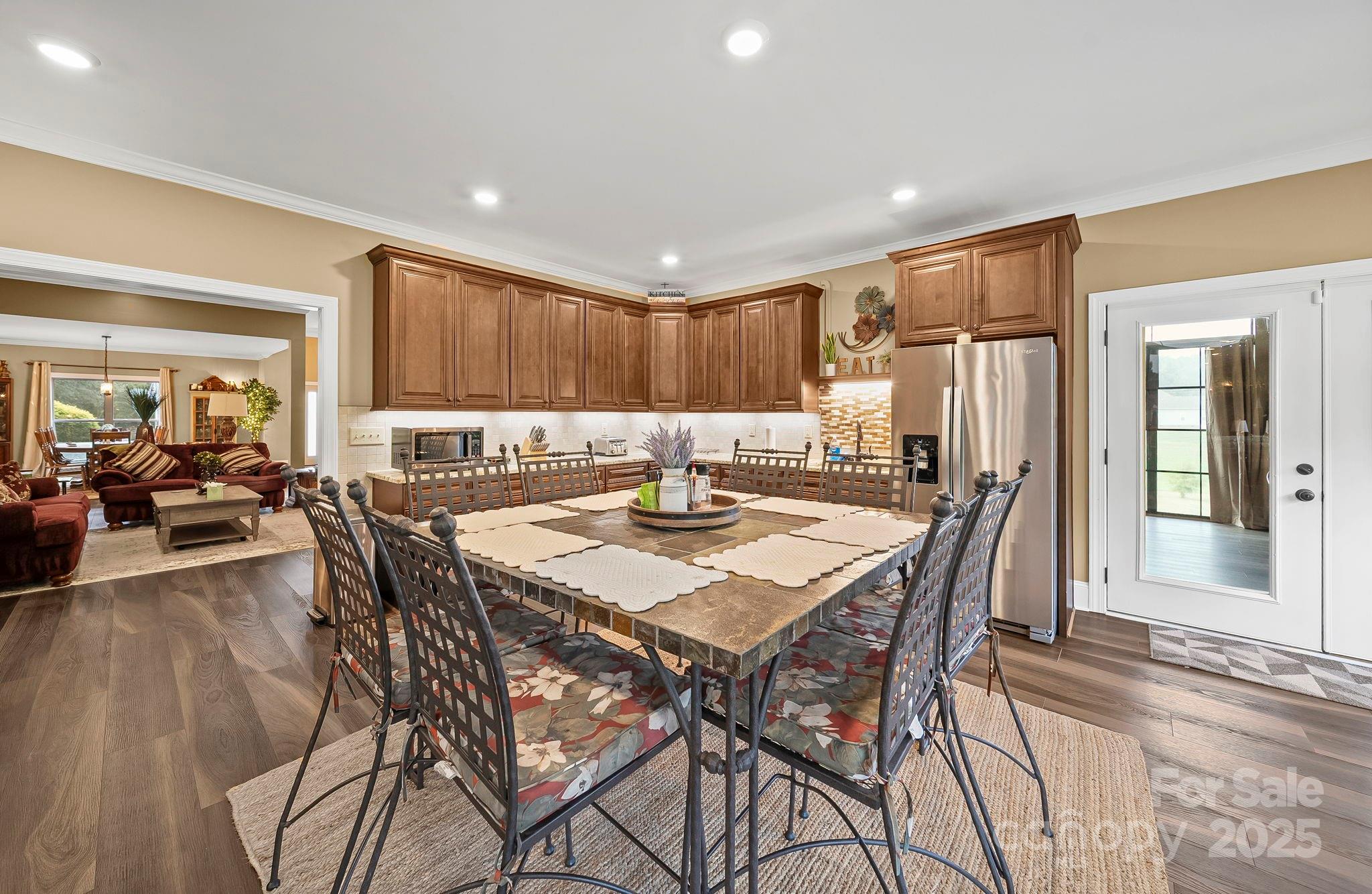5702 Army Road Marshville, NC 28103 - Photo 19 of 48 a kitchen with a table and chairs in it