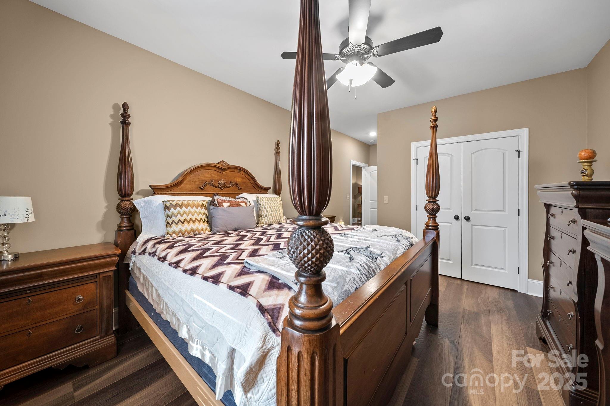 5702 Army Road Marshville, NC 28103 - Photo 28 of 48 a bedroom with a bed and a chandelier