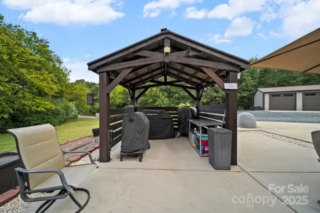 a view of a chairs and table in the patio