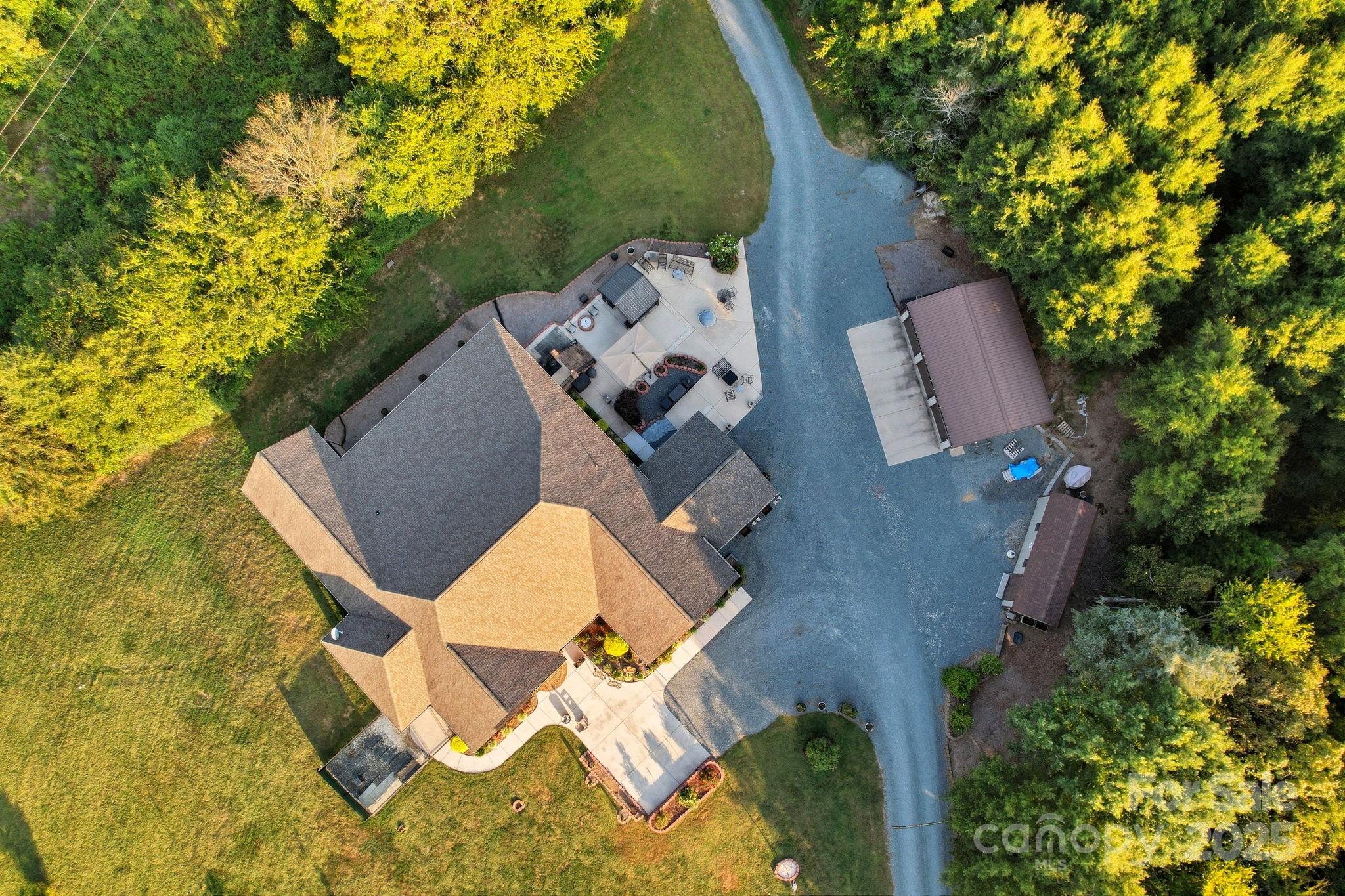 5702 Army Road Marshville, NC 28103 - Photo 42 of 48 an aerial view of a house with swimming pool and porch