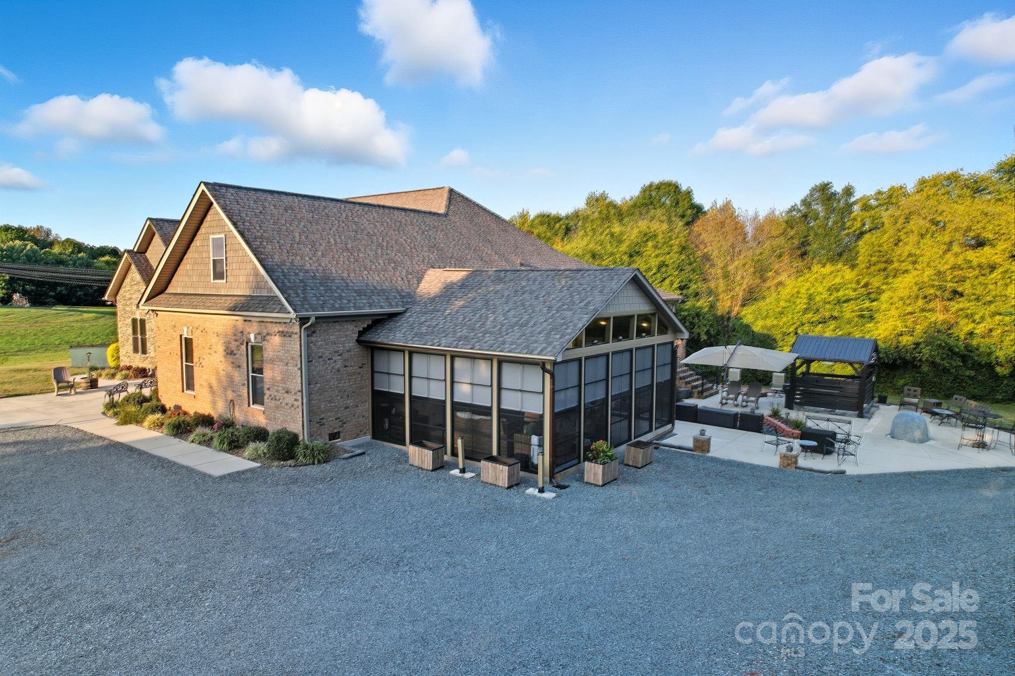 5702 Army Road Marshville, NC 28103 - Photo 43 of 48 a view of a house with wooden fence and roof