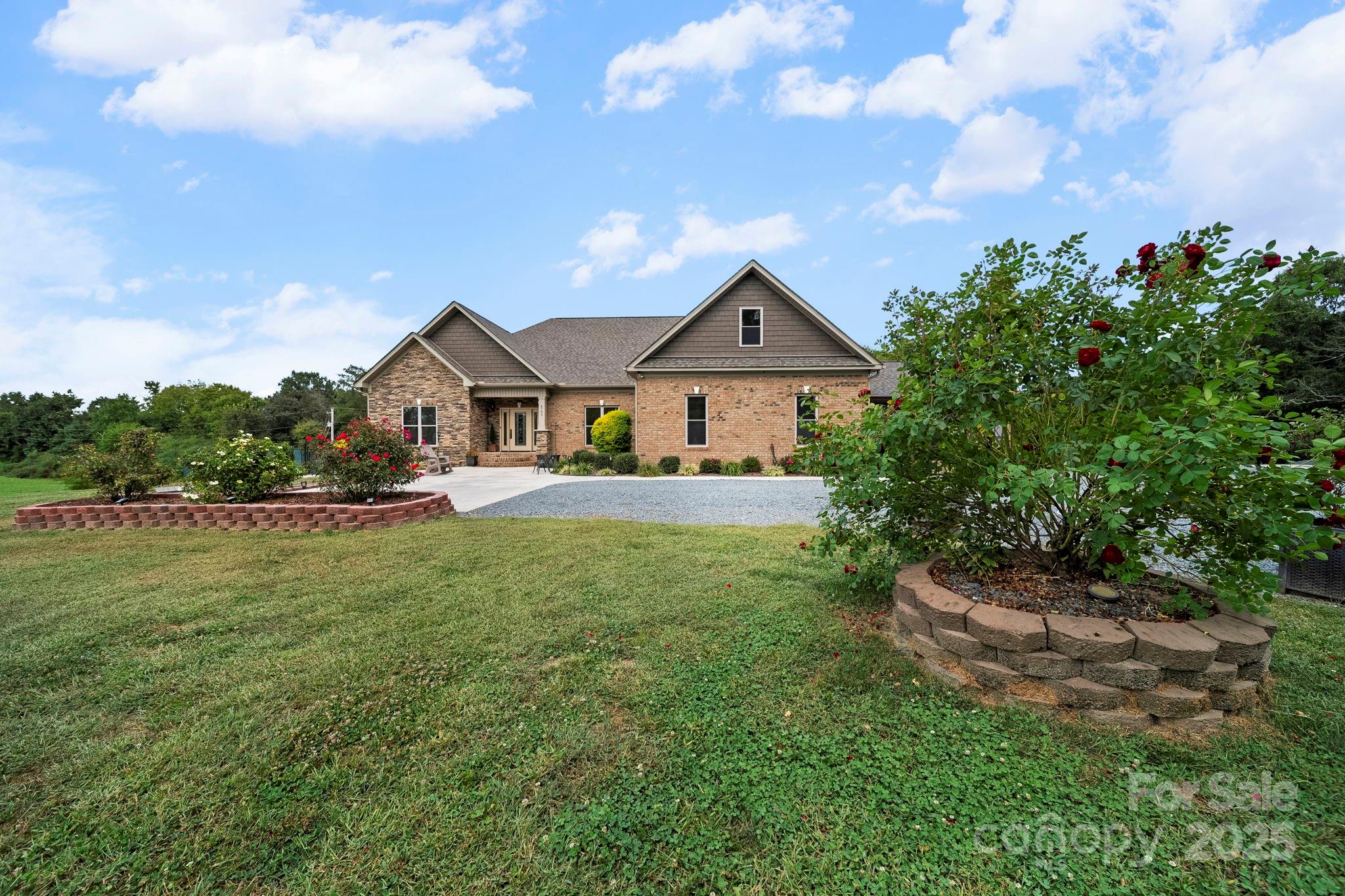 5702 Army Road Marshville, NC 28103 - Photo 44 of 48 a front view of a house with garden