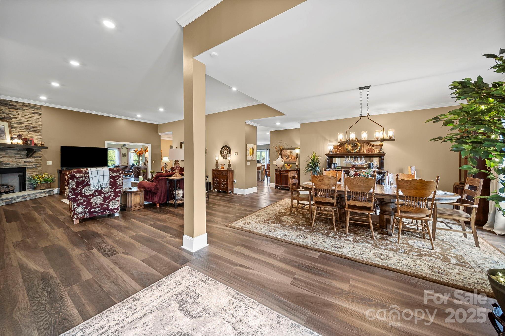 5702 Army Road Marshville, NC 28103 - Photo 7 of 48 a living room with furniture dining table and a chandelier
