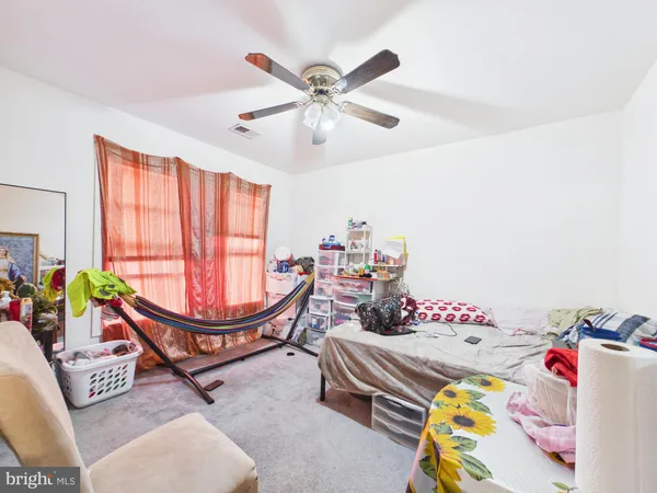 a bed room with furniture and a window