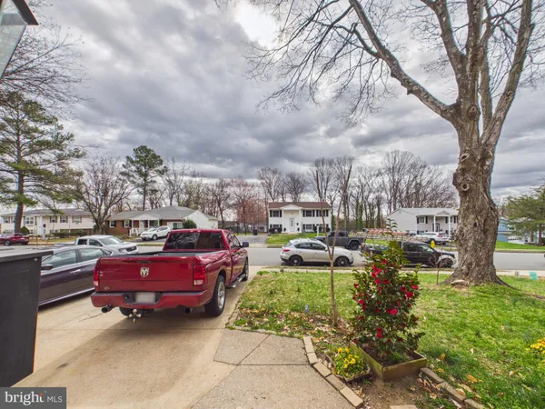 a view of a backyard with sitting area