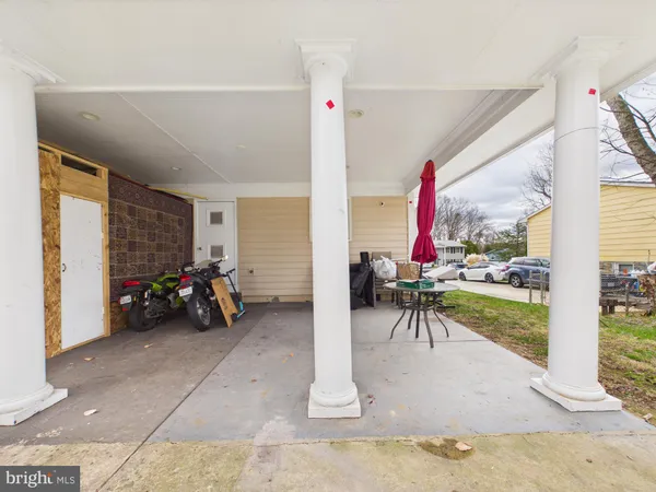 a view of a livingroom with furniture and a porch