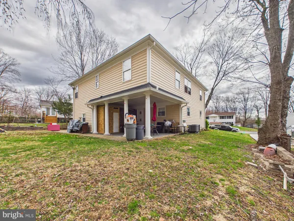 a view of a house with a yard and garden