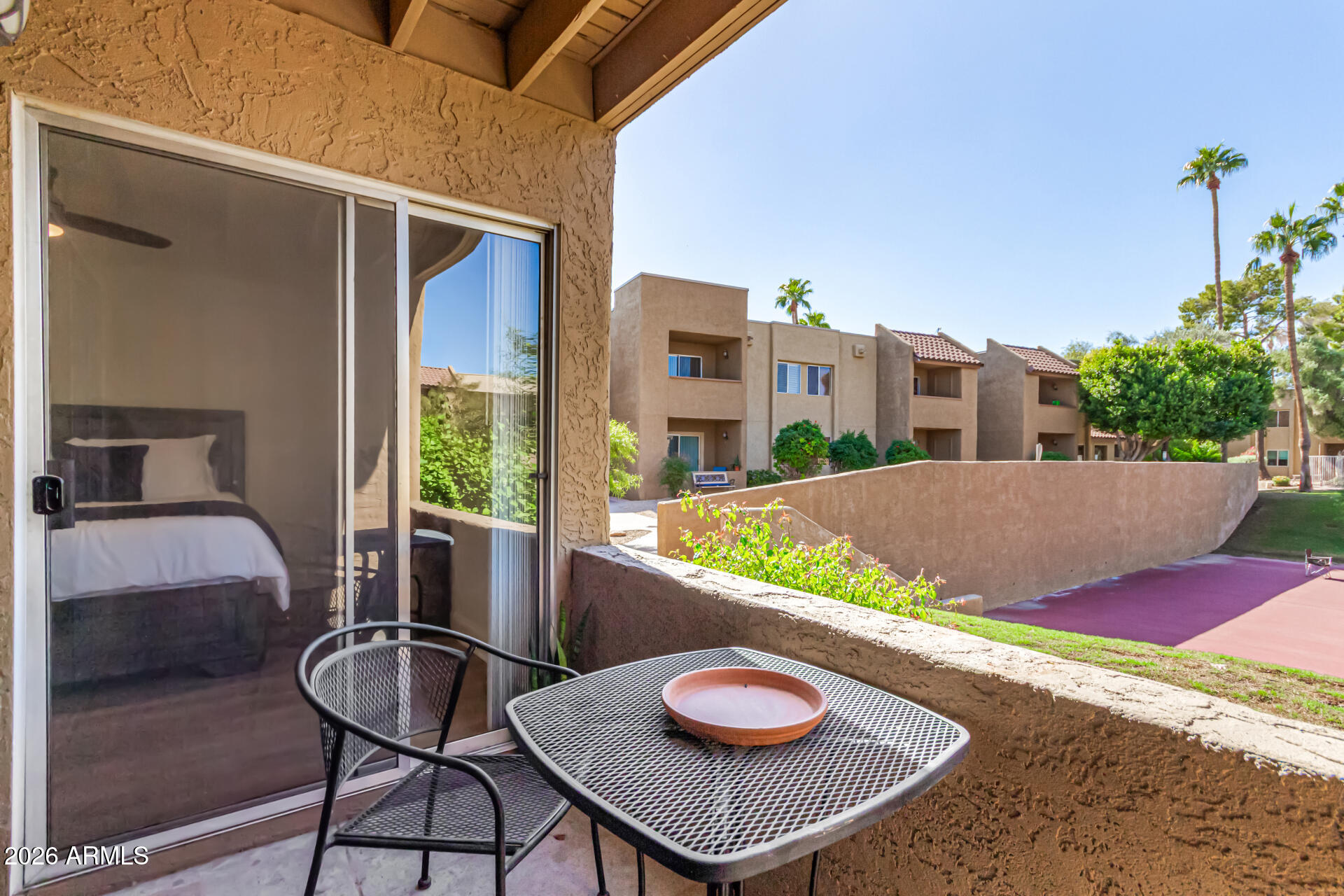 5877 North Granite Reef Road, Unit 1133 Scottsdale, AZ 85250 - Photo 23 of 33 a balcony with furniture and a potted plant
