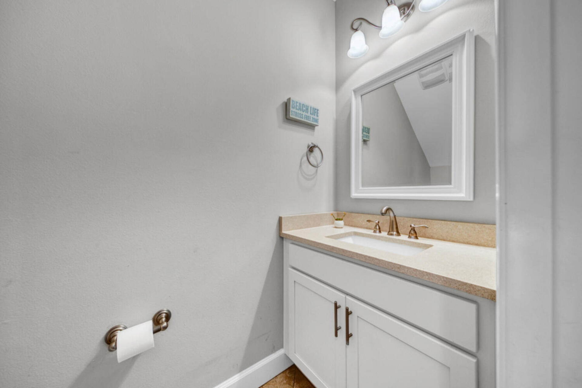 507 Johnson Street Valparaiso, FL 32580 - Photo 12 of 40 a bathroom with a sink vanity and mirror