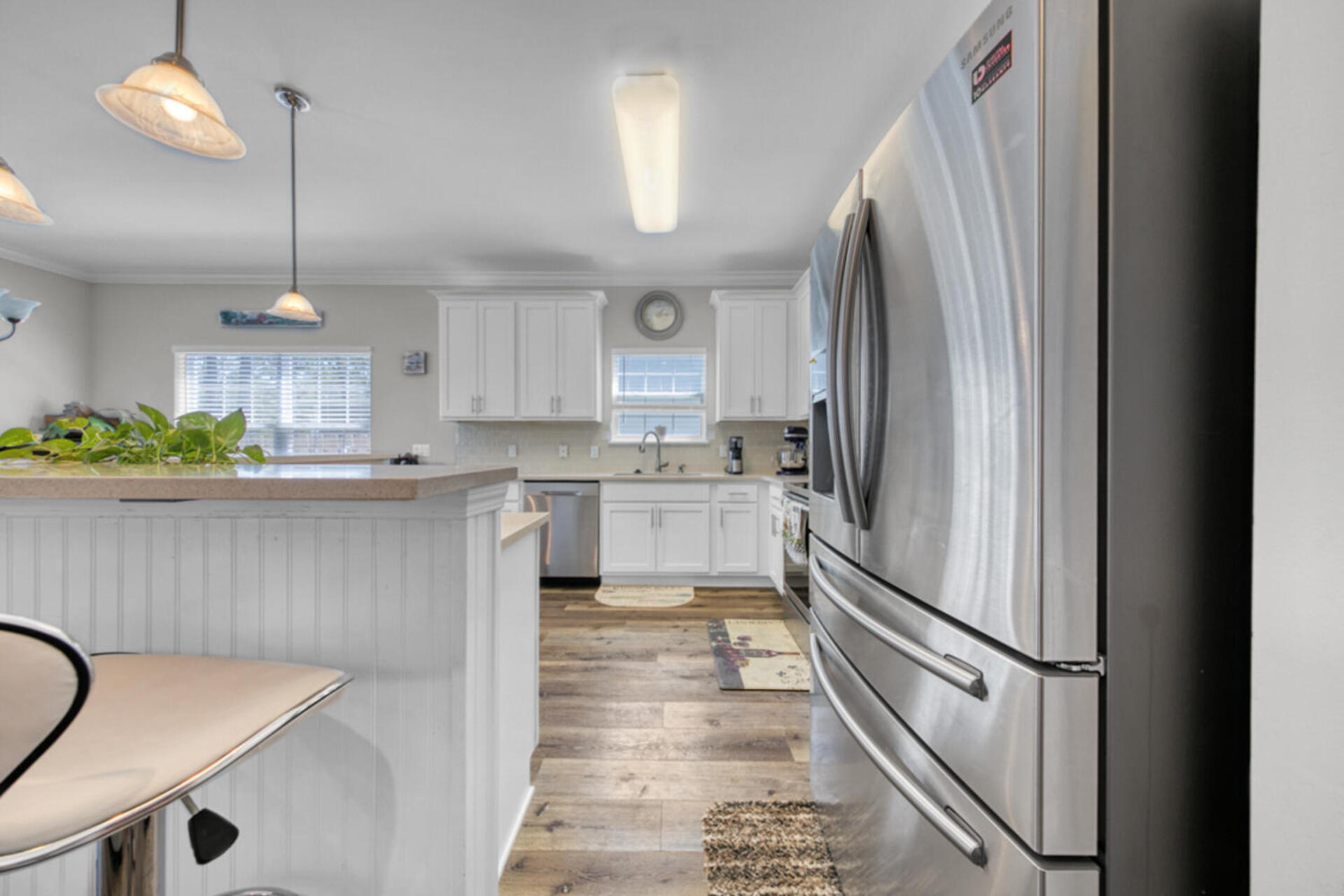 507 Johnson Street Valparaiso, FL 32580 - Photo 14 of 40 a kitchen with stainless steel appliances granite countertop a refrigerator a sink and a stove