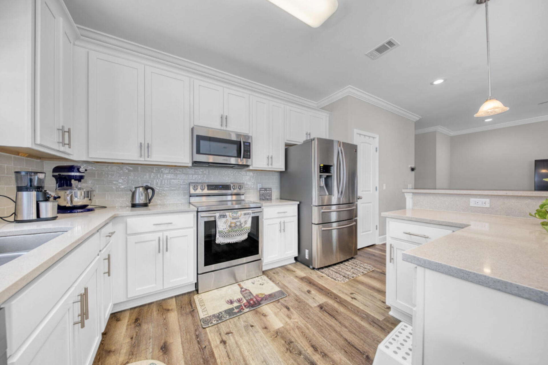 507 Johnson Street Valparaiso, FL 32580 - Photo 15 of 40 a kitchen with a sink stove and refrigerator