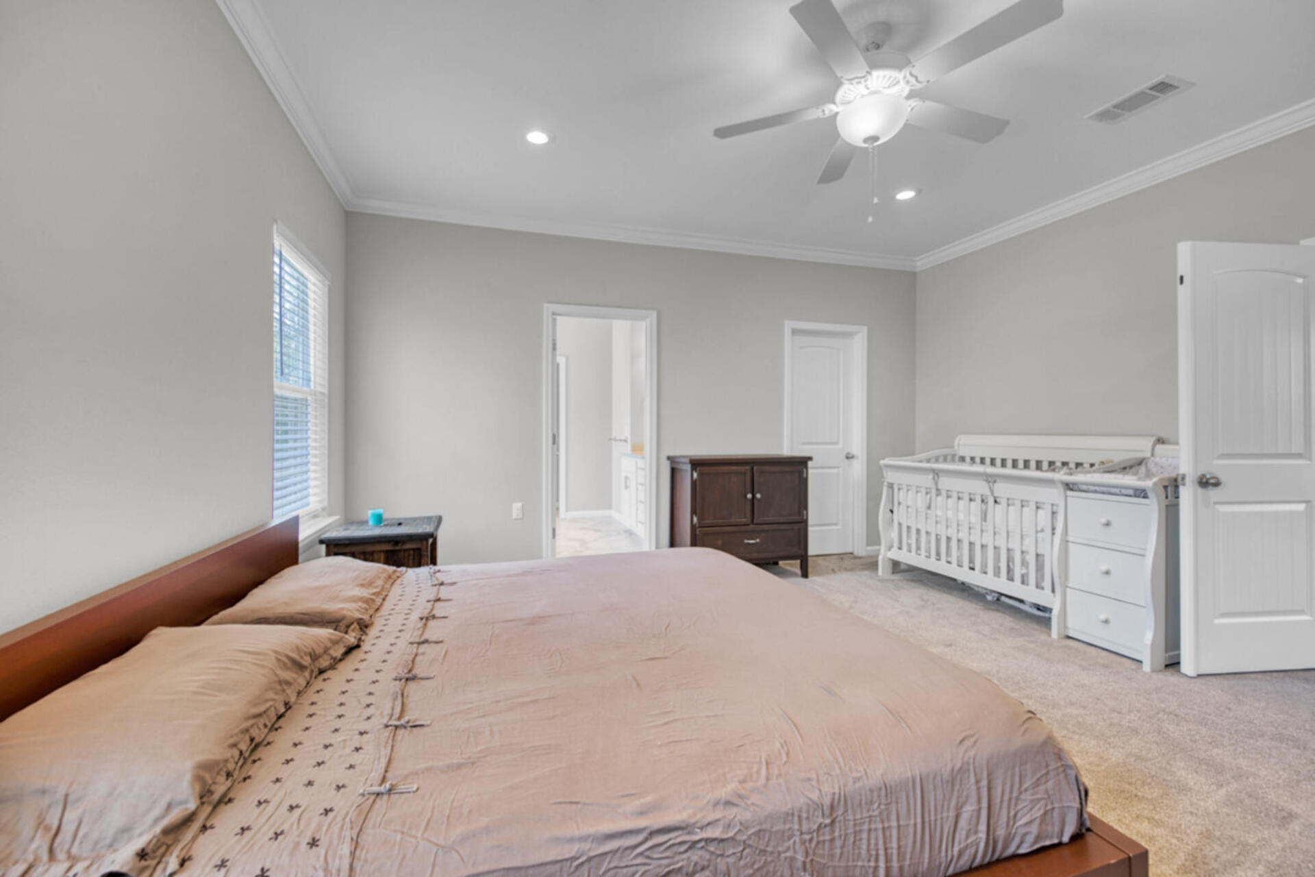 507 Johnson Street Valparaiso, FL 32580 - Photo 23 of 40 a bedroom with a bed and ceiling fan