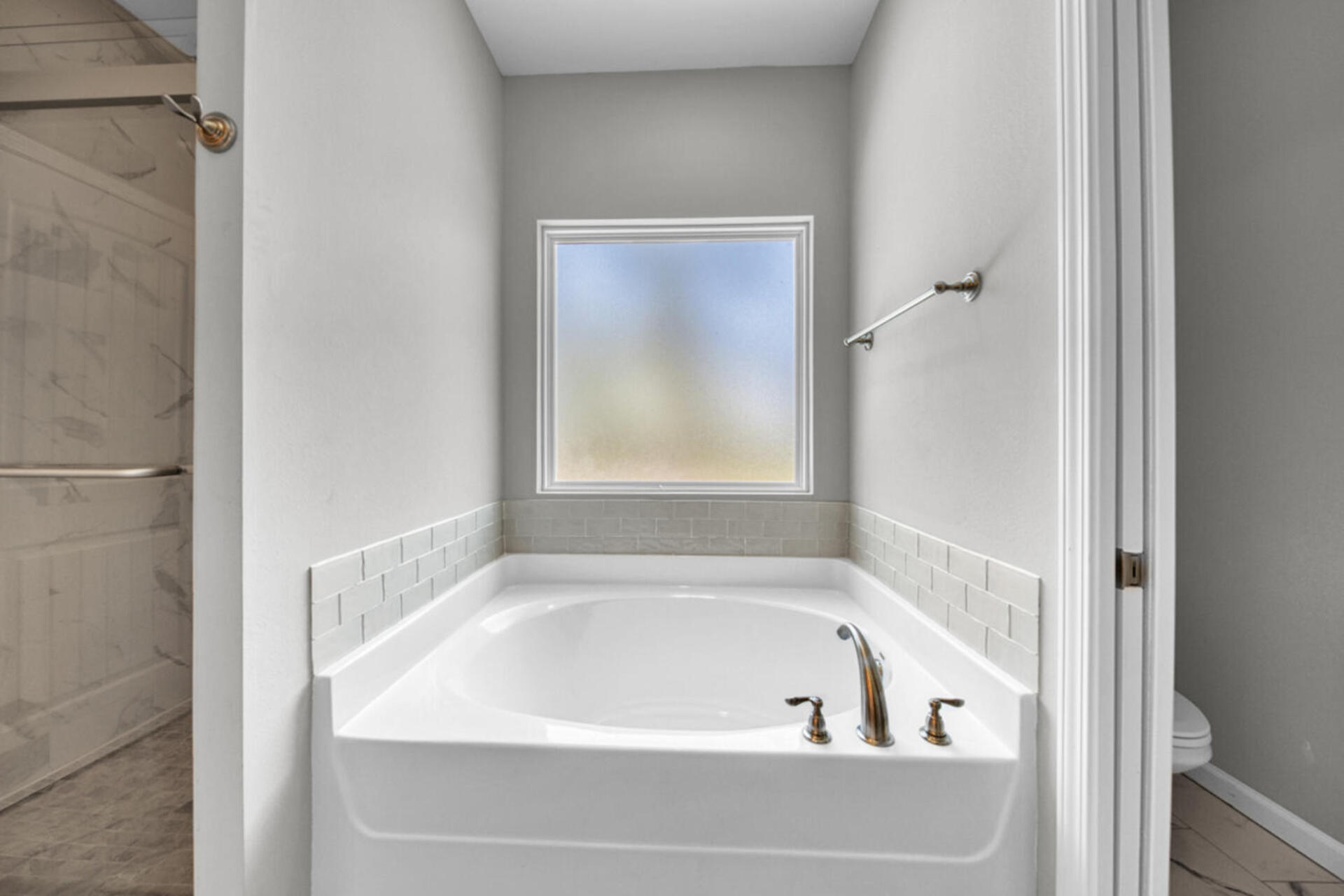 507 Johnson Street Valparaiso, FL 32580 - Photo 26 of 40 a white bath tub sitting next to a window