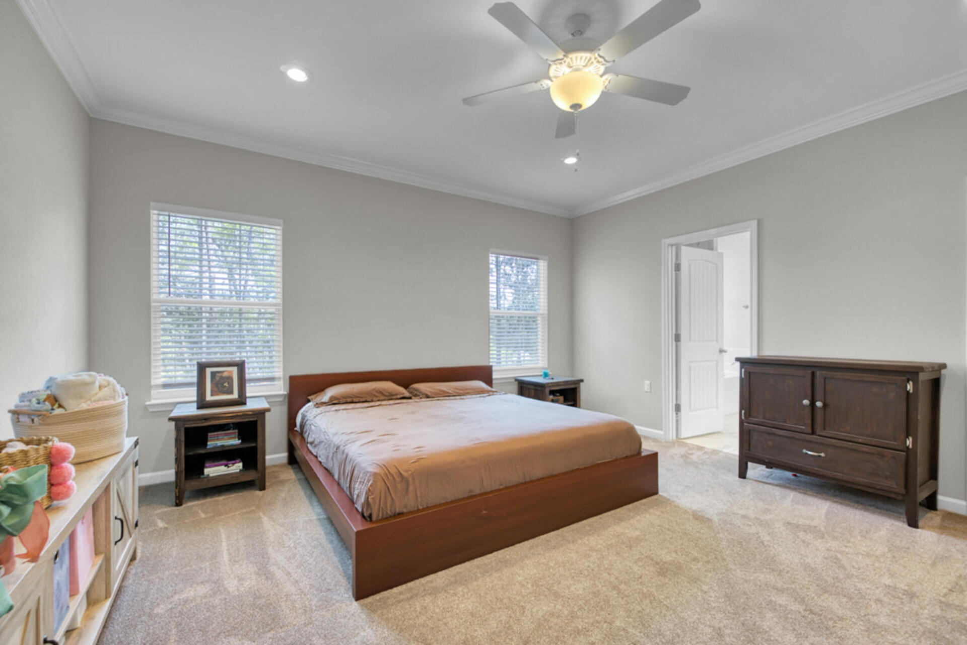 507 Johnson Street Valparaiso, FL 32580 - Photo 28 of 40 a bedroom with a bed and a chandelier