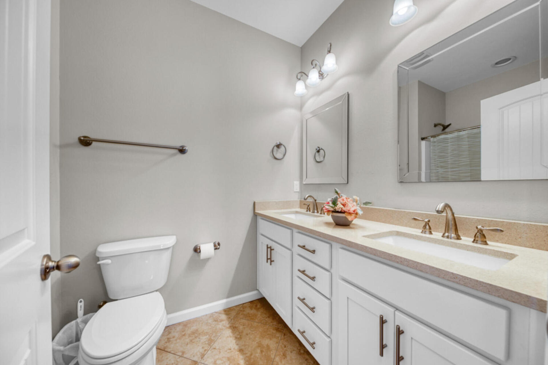 507 Johnson Street Valparaiso, FL 32580 - Photo 31 of 40 a bathroom with a toilet sink and mirror