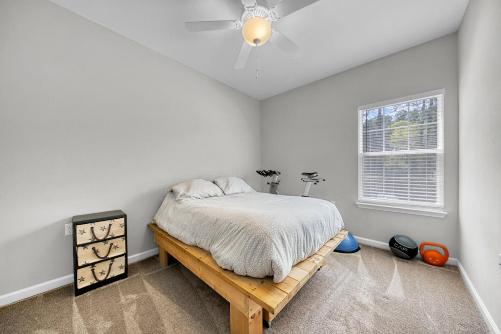 507 Johnson Street Valparaiso, FL 32580 - Photo 38 of 40 a bedroom with a bed and a chandelier