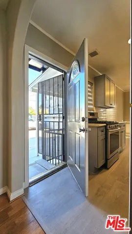 a view of a kitchen with a sink and dishwasher