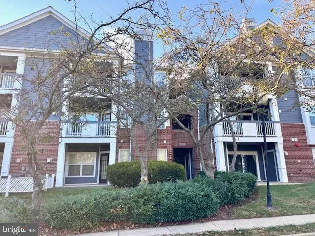 a view of a room with wooden floor and fireplace