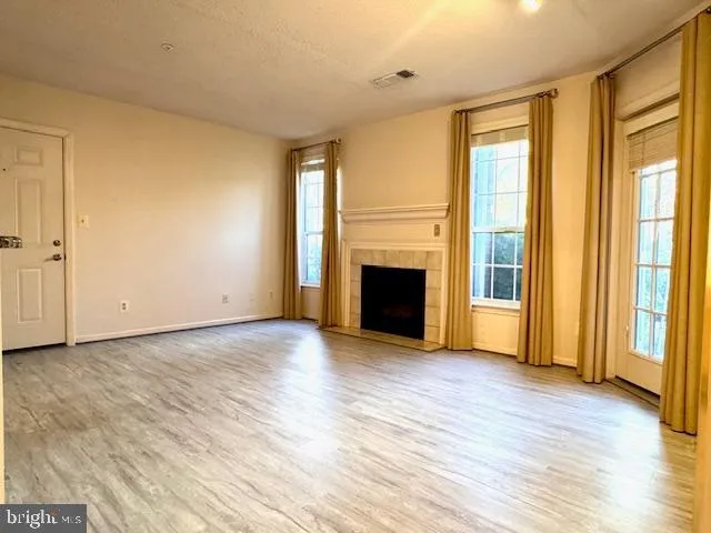 a view of a kitchen with a sink and cabinets