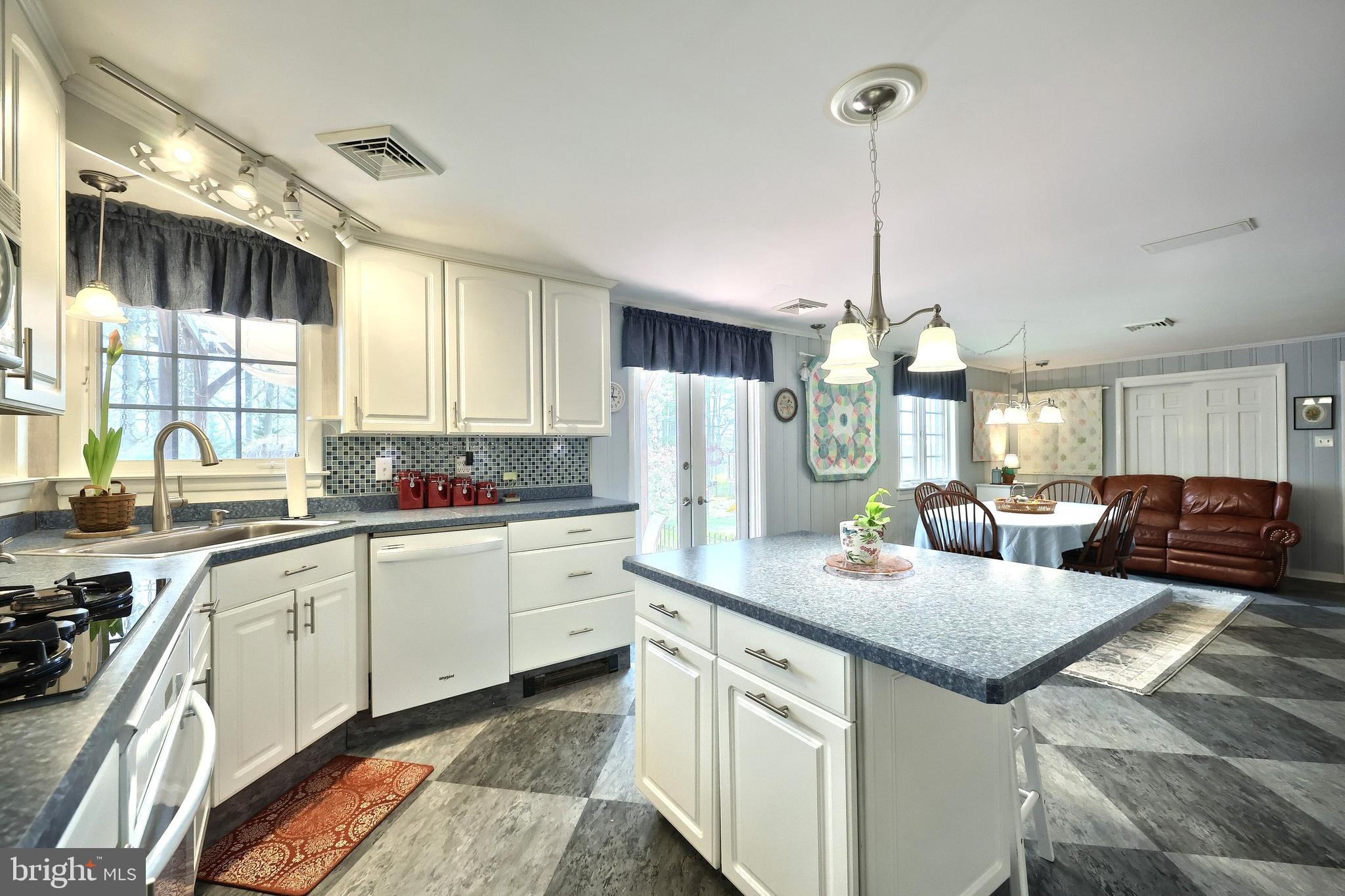 4204 Grandview Road Hanover, PA 17331 - Photo 23 of 77 a kitchen with stainless steel appliances granite countertop a sink a stove a refrigerator cabinets and chairs