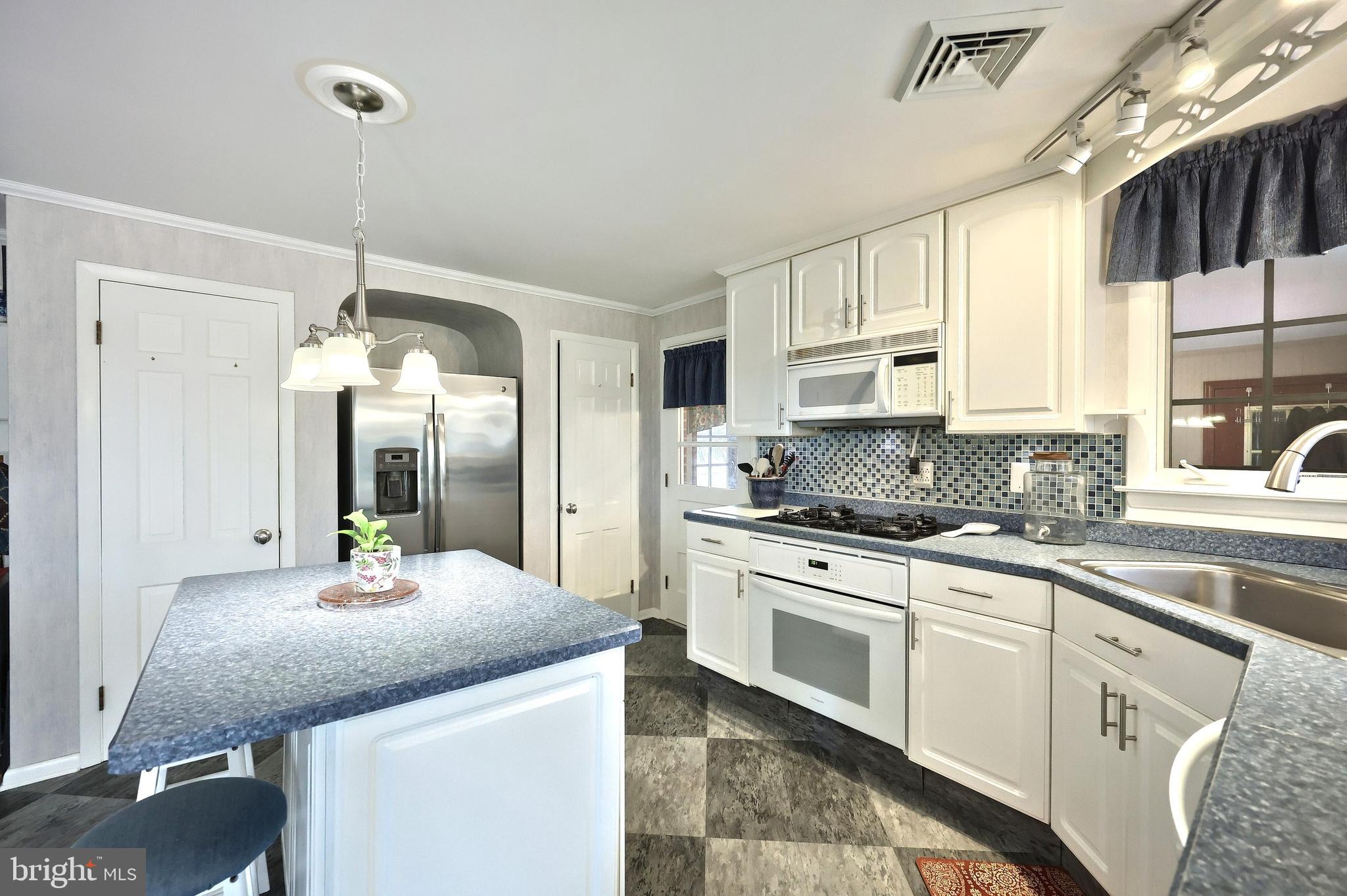 4204 Grandview Road Hanover, PA 17331 - Photo 24 of 77 a kitchen with stainless steel appliances granite countertop a sink a stove and refrigerator
