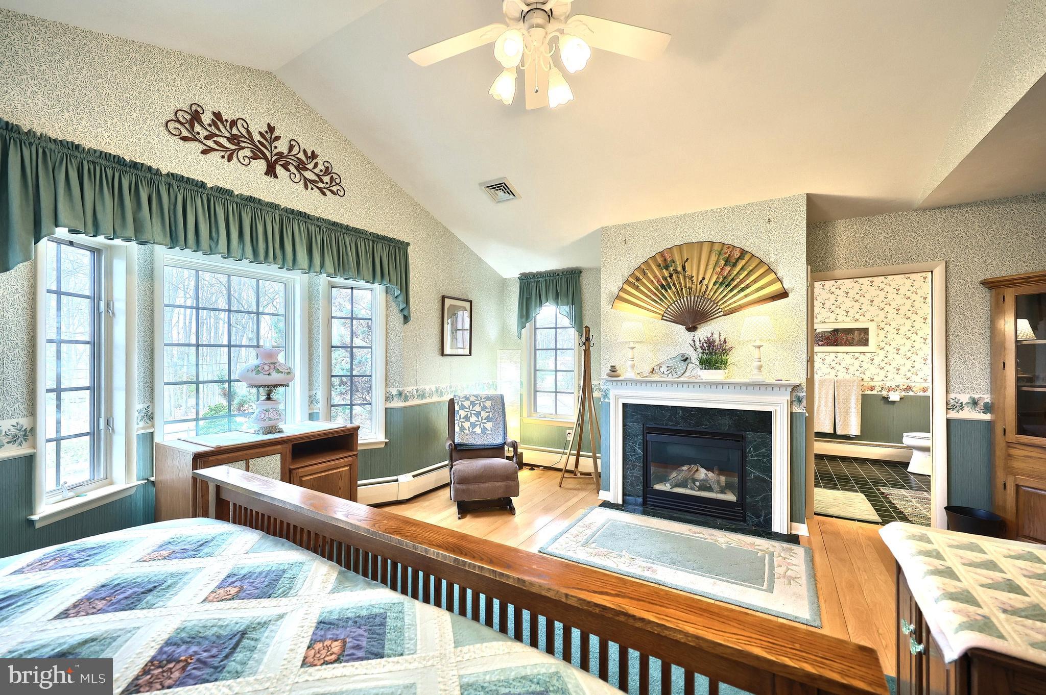 4204 Grandview Road Hanover, PA 17331 - Photo 43 of 77 a living room with furniture a fireplace and a chandelier