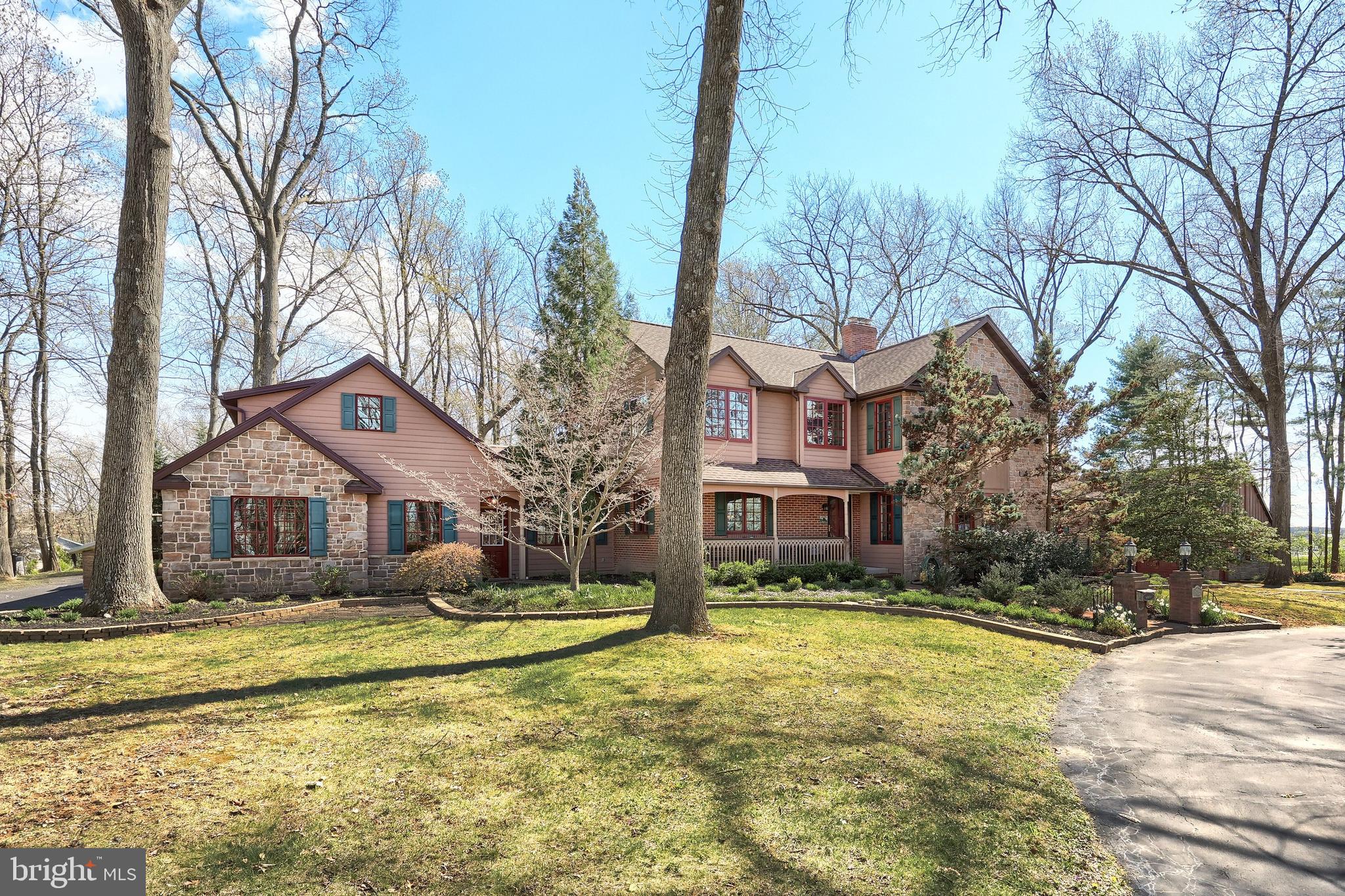 4204 Grandview Road Hanover, PA 17331 - Photo 5 of 77 a front view of a house with a yard covered with snow and trees