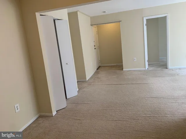 a white toilet sitting next to a bathroom sink and vanity