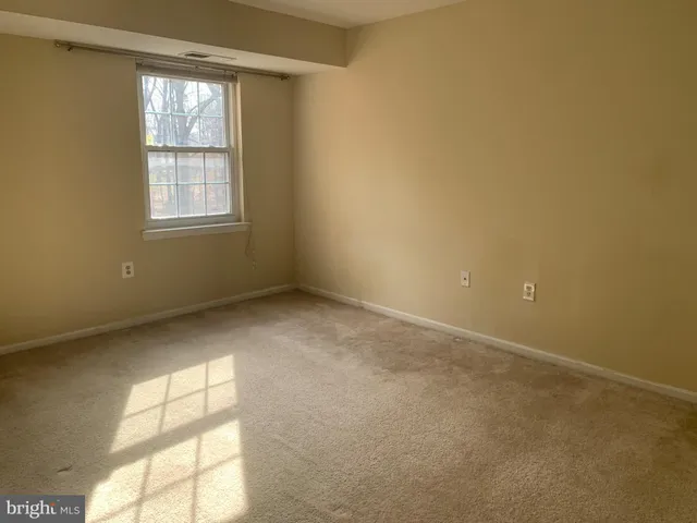 an empty room with a windows