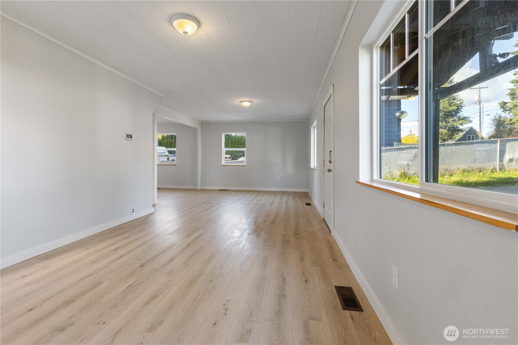 312 Nevada Drive Longview, WA 98632 - Photo 15 of 27 wooden floor in an empty room with a window