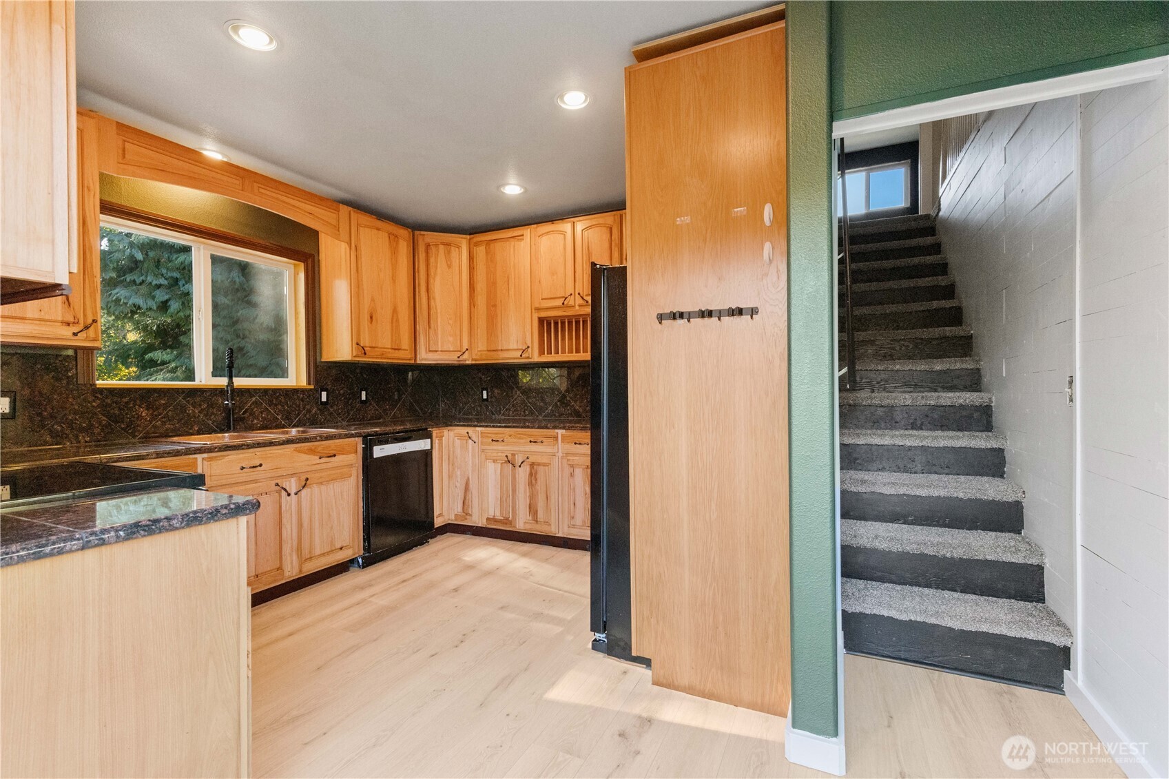 312 Nevada Drive Longview, WA 98632 - Photo 9 of 27 a kitchen with a refrigerator and a sink