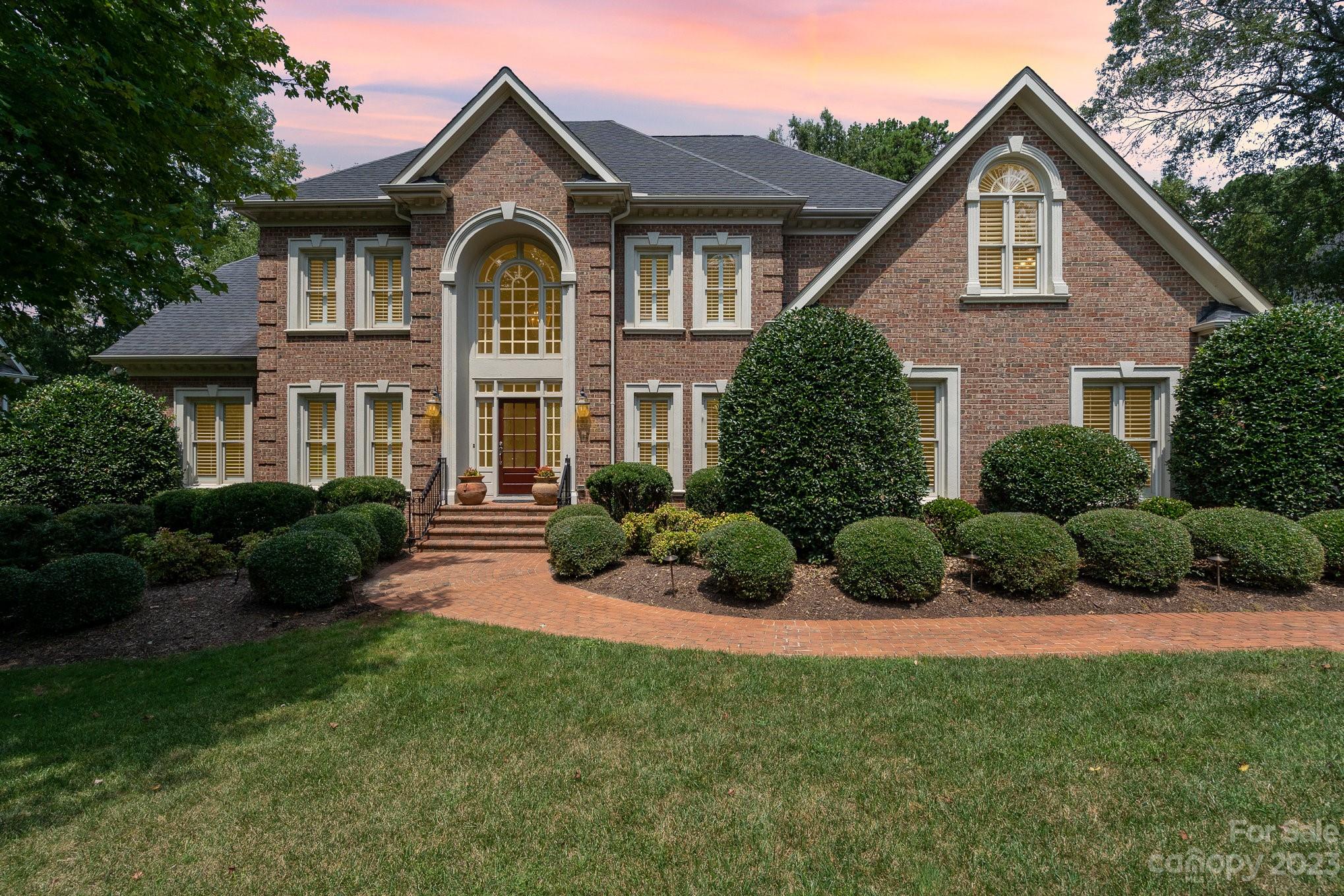 6535 Seton House Lane Charlotte, NC 28277 - Photo 1 of 48 a front view of a house with a yard