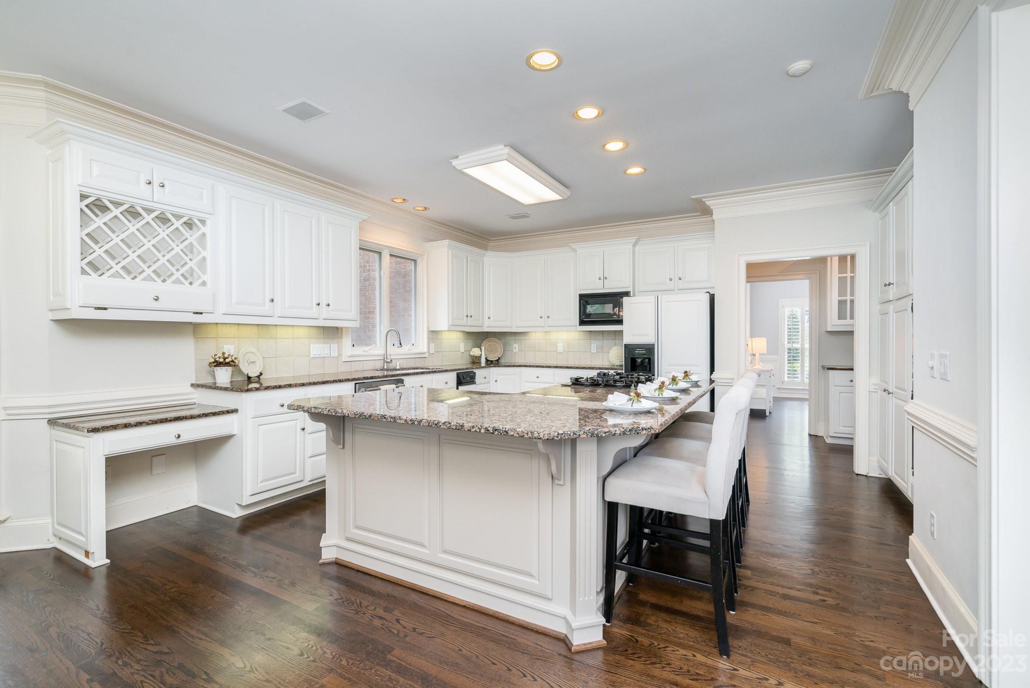 6535 Seton House Lane Charlotte, NC 28277 - Photo 14 of 48 a kitchen with appliances a sink a counter top space and cabinets