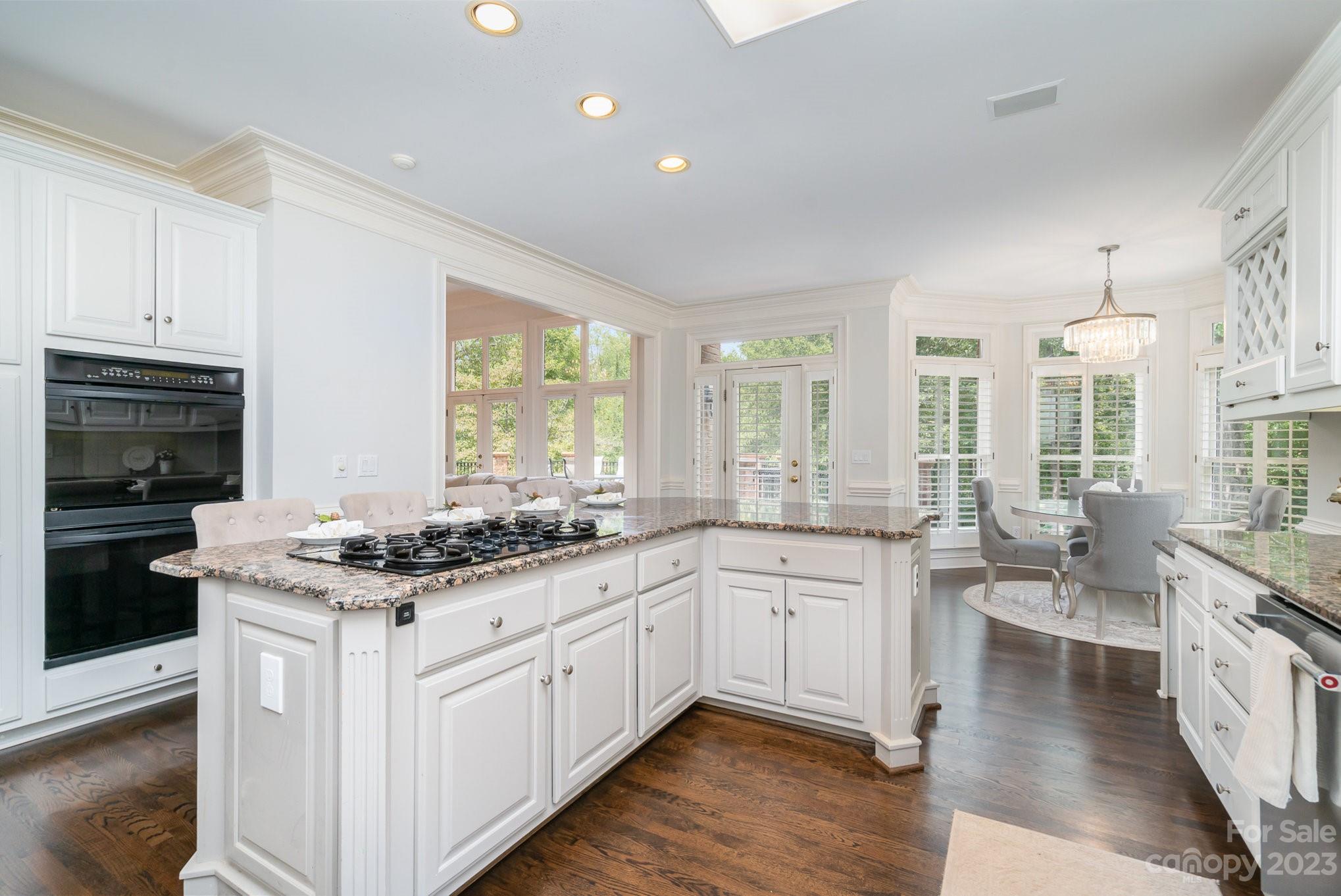 6535 Seton House Lane Charlotte, NC 28277 - Photo 16 of 48 a kitchen with a sink stove and cabinets