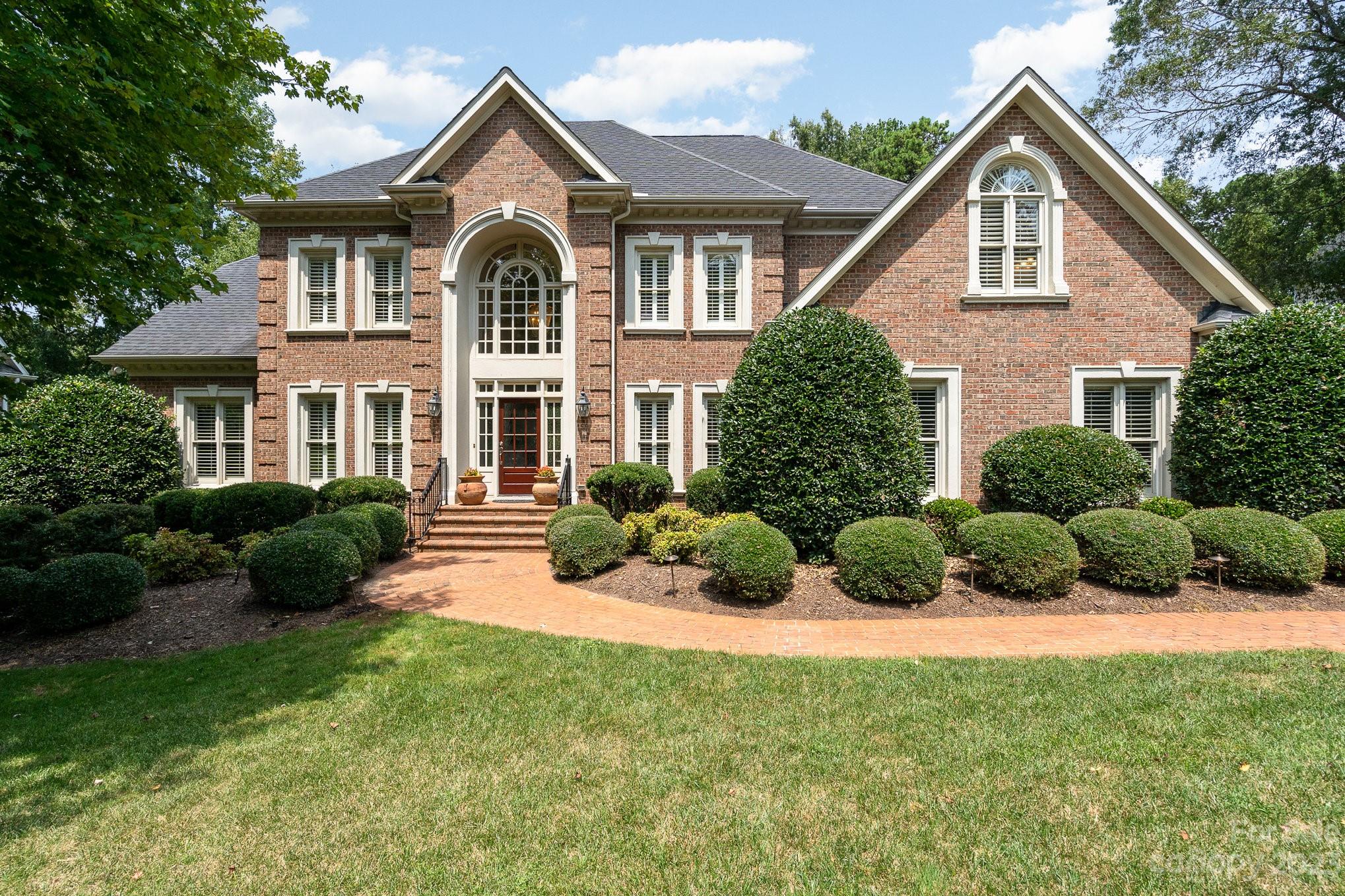 6535 Seton House Lane Charlotte, NC 28277 - Photo 2 of 48 a front view of a house with a yard