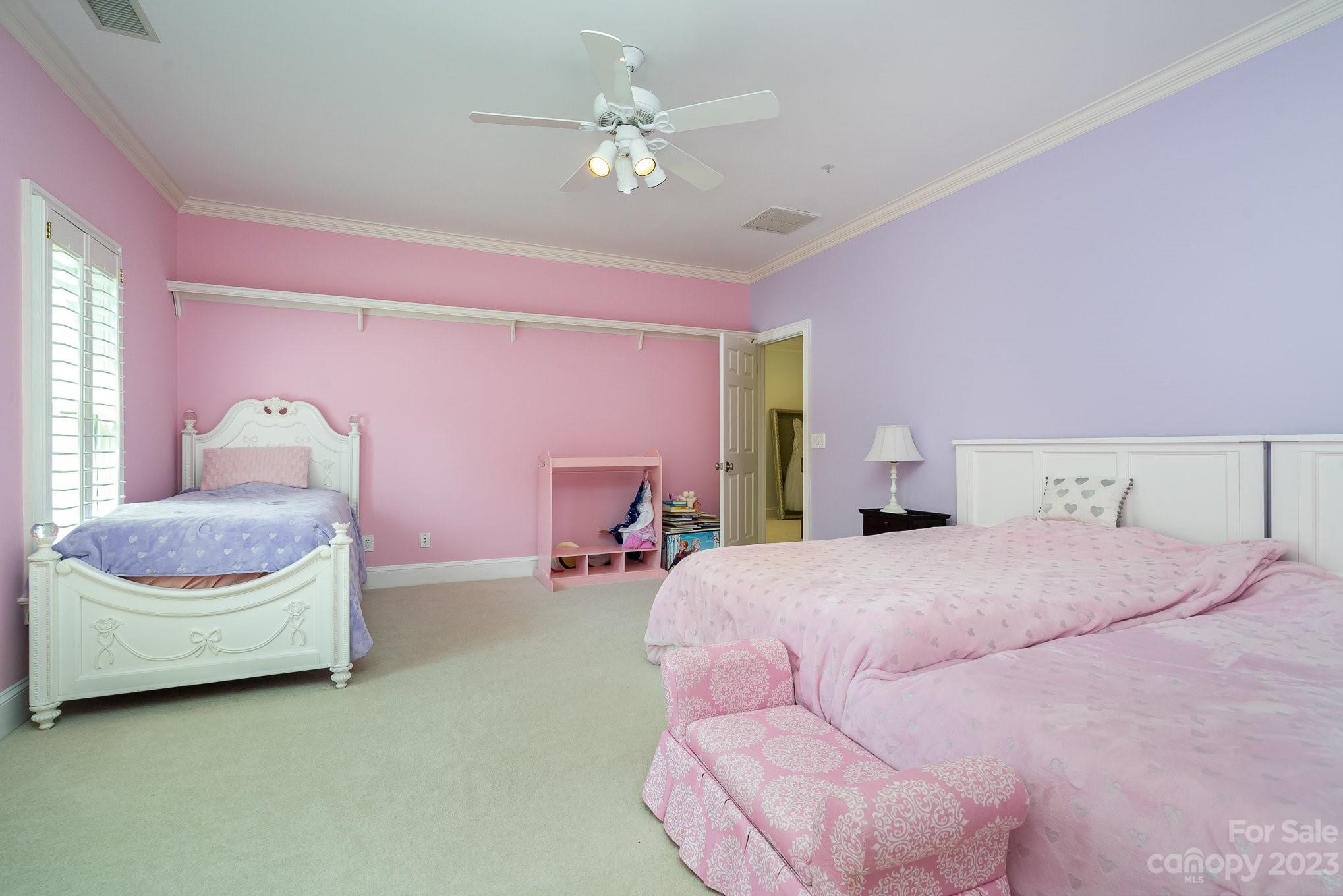 6535 Seton House Lane Charlotte, NC 28277 - Photo 26 of 48 a bedroom with a bed chair and a chandelier